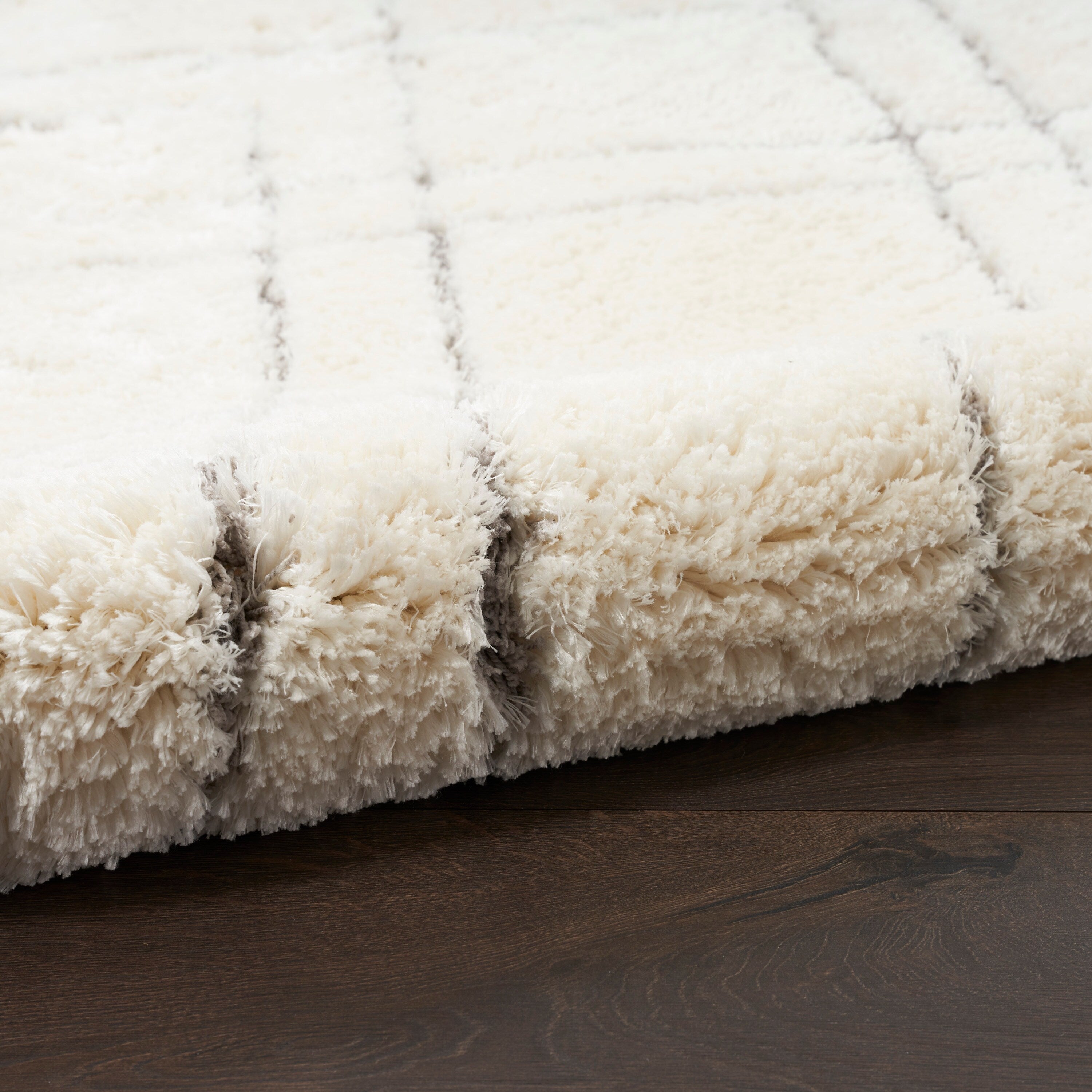Tapis Nourison luxueux à poils longs et ultra moelleux, motif géométrique abstrait