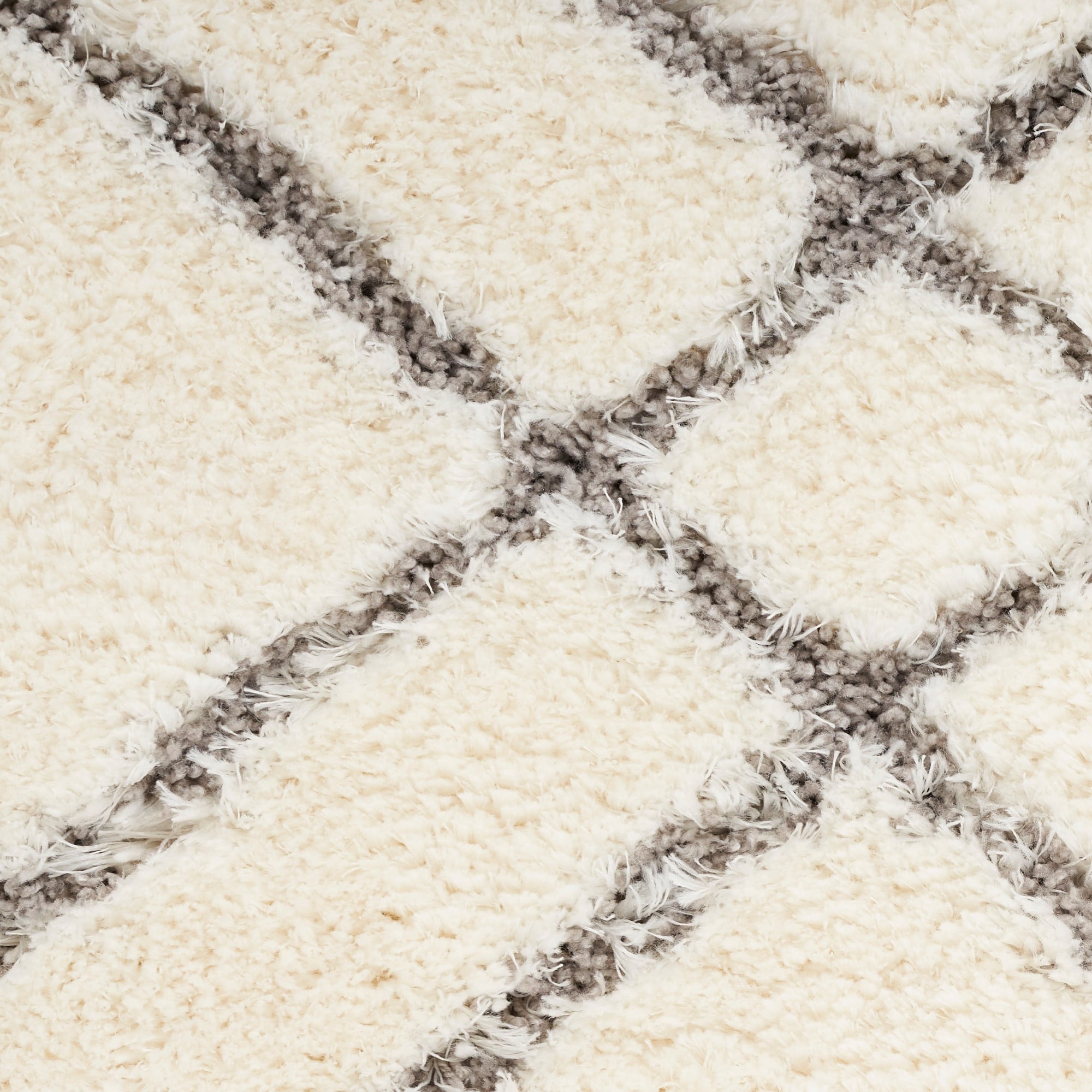 Tapis Nourison luxueux à poils longs et ultra moelleux, motif géométrique abstrait