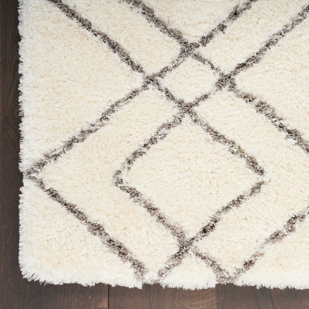 Tapis Nourison luxueux à poils longs et ultra moelleux, motif géométrique abstrait