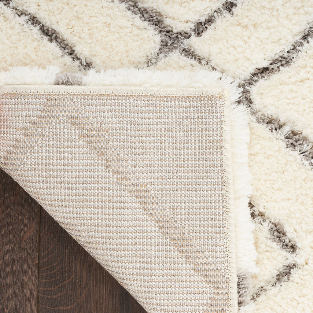 Tapis Nourison luxueux à poils longs et ultra moelleux, motif géométrique abstrait