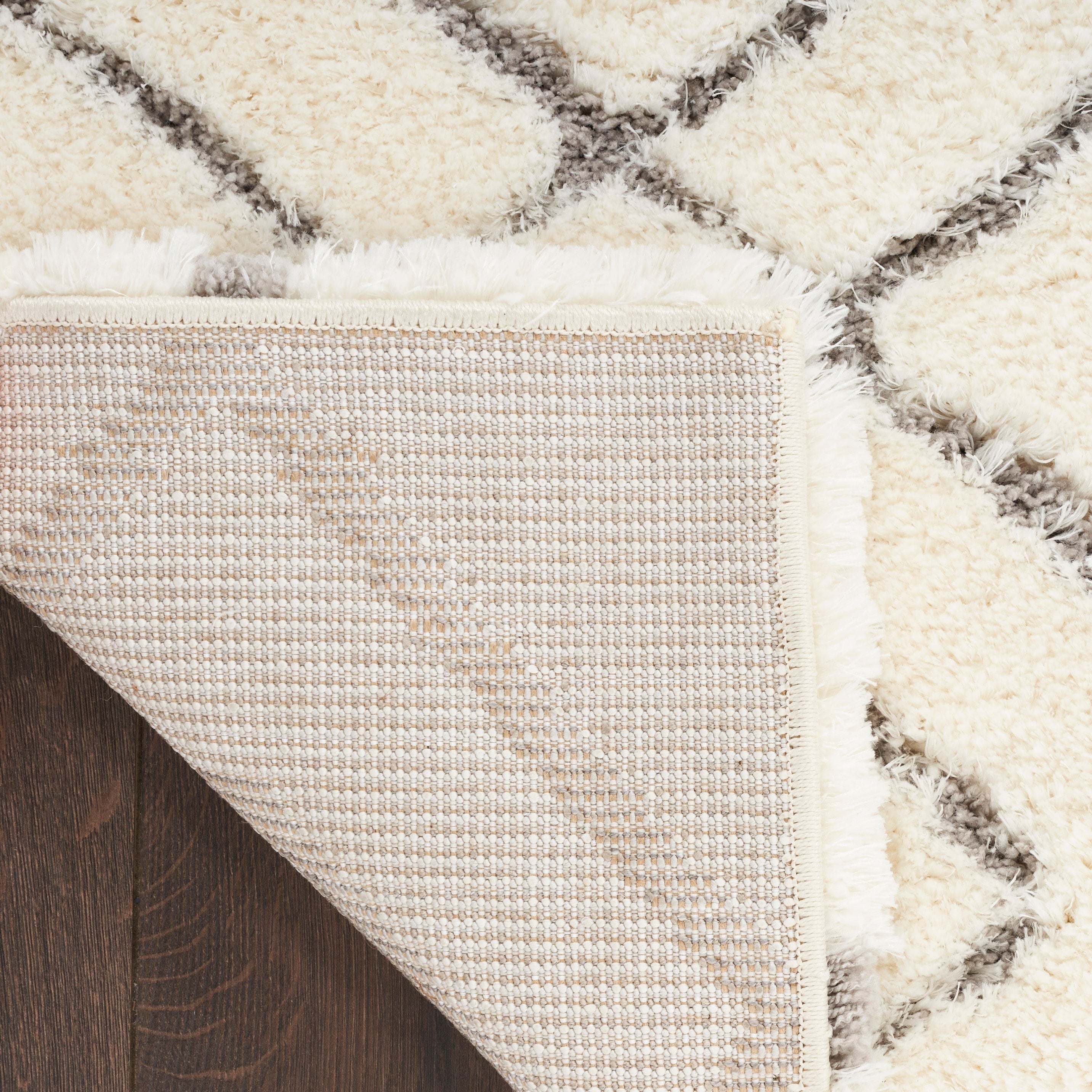 Tapis Nourison luxueux à poils longs et ultra moelleux, motif géométrique abstrait